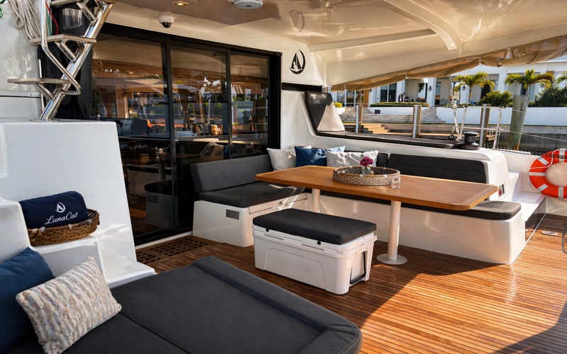 Luna Cat cockpit seating area with teak deck and dining table