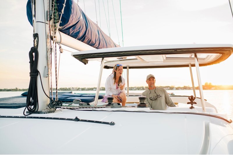 Couple aboard LunaCat at sunset
