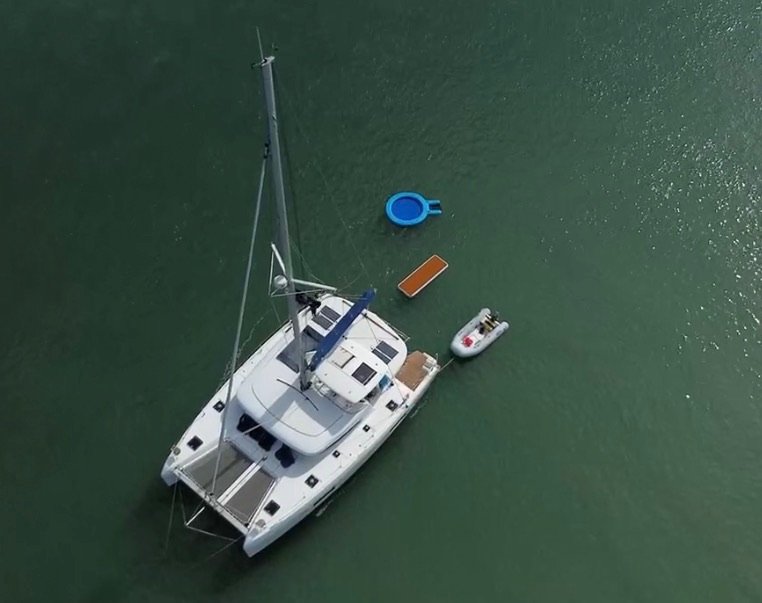 Aerial view of LunaCat anchored with tender alongside