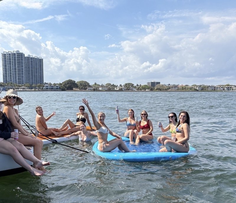 Group celebrating aboard LunaCat
